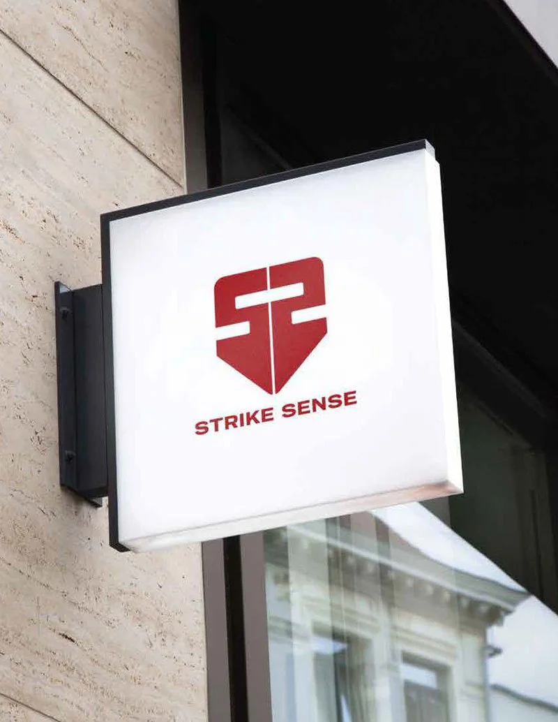 Strike Sense brandmark on a lit wall sign